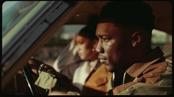 Movie still from “Giveon - Heartbreak Anniversary” (2021), directed by Salomon Ligthelm – Close Up shot, Over the shoulder angle