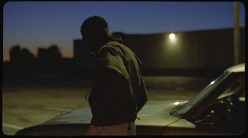 Movie still from “Giveon - Heartbreak Anniversary” (2021), directed by Salomon Ligthelm – Medium shot, Low angle