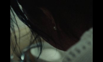 Movie still from “Jordan Klassen - Golden Ladder” (2021), directed by Farhad Ghaderi – Extreme Close Up shot, Over the shoulder angle