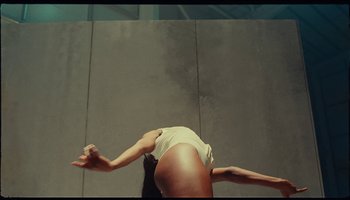 Movie still from “Wizkid - Ginger” (2021), directed by Meji Alabi – Medium shot, Overhead angle