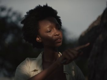 Movie still from “Sam Dew - NTWFL” (2020), directed by Young Replicant – Close Up shot, Low angle