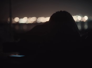 Movie still from “Sam Dew - NTWFL” (2020), directed by Young Replicant – Medium shot, Low angle