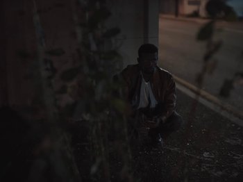 Movie still from “Sam Dew - NTWFL” (2020), directed by Young Replicant – Medium shot, High angle