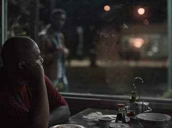 Movie still from “Sam Dew - NTWFL” (2020), directed by Young Replicant – Medium shot, Over the shoulder angle