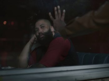 Movie still from “Sam Dew - NTWFL” (2020), directed by Young Replicant – Close Up shot, Over the shoulder angle