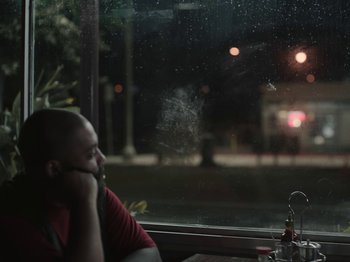 Movie still from “Sam Dew - NTWFL” (2020), directed by Young Replicant – Close Up shot, Over the shoulder angle