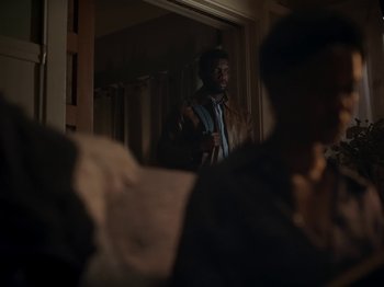 Movie still from “Sam Dew - NTWFL” (2020), directed by Young Replicant – Medium shot, Over the shoulder angle