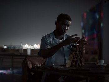 Movie still from “Sam Dew - NTWFL” (2020), directed by Young Replicant – Medium shot, Low angle