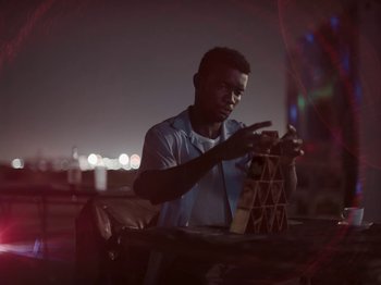 Movie still from “Sam Dew - NTWFL” (2020), directed by Young Replicant – Medium shot, Low angle