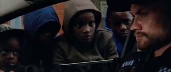 Movie still from “Ghetts feat. Skepta - IC3” (2020), directed by Hector Dockrill – Close Up shot, Low angle