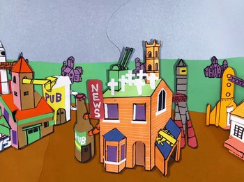 Movie still from “Idles - Model Village” (2020), directed by Olivier Gondry – Extreme Wide shot, Low angle