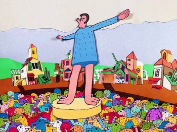 Movie still from “Idles - Model Village” (2020), directed by Olivier Gondry – Wide shot, Low angle
