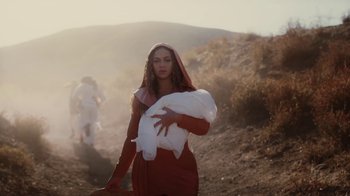 Movie still from “Beyoncé (Trailer) - Black Is King” (2020), directed by Jenn Nkiru – Medium shot, Low angle