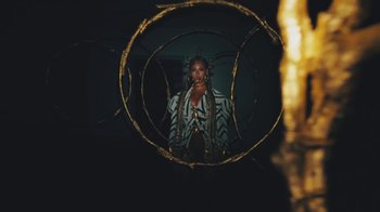 Movie still from “Beyoncé (Trailer) - Black Is King” (2020), directed by Jenn Nkiru – Medium shot, Overhead angle