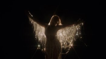 Movie still from “Beyoncé (Trailer) - Black Is King” (2020), directed by Jenn Nkiru – Medium shot, Low angle