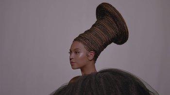 Movie still from “Beyoncé (Trailer) - Black Is King” (2020), directed by Jenn Nkiru – Close Up shot, Low angle
