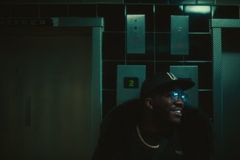 Movie still from “BERWYN - Trap Phone” (2020), directed by Brock Neal-Roberts – Medium shot, Low angle