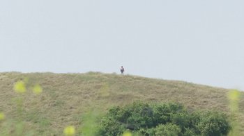 Movie still from “MORE - Settled In” (2020), directed by Justin Daashuur Hopkins – Extreme Wide shot, Low angle