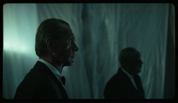 Movie still from “AYIA - Easy” (2020), directed by Salomon Ligthelm – Medium shot, Over the shoulder angle