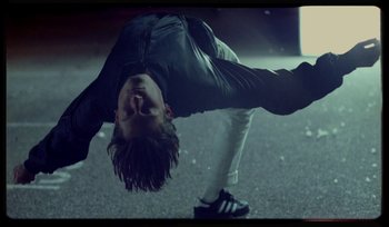 Movie still from “AYIA - Easy” (2020), directed by Salomon Ligthelm – Medium shot, Low angle