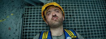 Movie still from “Woodkid - Goliath” (2020), directed by Yoann Lemoine – Close Up shot, Overhead angle