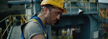 Movie still from “Woodkid - Goliath” (2020), directed by Yoann Lemoine – Close Up shot, Low angle