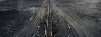 Movie still from “Woodkid - Goliath” (2020), directed by Yoann Lemoine – Extreme Wide shot, Overhead angle