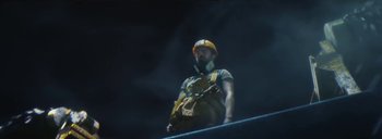 Movie still from “Woodkid - Goliath” (2020), directed by Yoann Lemoine – Medium shot, Low angle