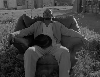 Movie still from “Leonard Cohen - The Hills” (2020), directed by Vincent Haycock – Medium shot, Low angle
