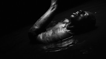 Movie still from “Neumodel feat. Kiddy Smile - Hayah” (2020), directed by Axel Morin – Extreme Close Up shot, Overhead angle