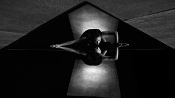 Movie still from “Neumodel feat. Kiddy Smile - Hayah” (2020), directed by Axel Morin – Extreme Close Up shot, Overhead angle
