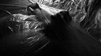 Movie still from “Neumodel feat. Kiddy Smile - Hayah” (2020), directed by Axel Morin – Extreme Close Up shot, Overhead angle