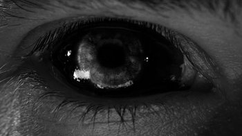 Movie still from “Neumodel feat. Kiddy Smile - Hayah” (2020), directed by Axel Morin – Extreme Close Up shot, Overhead angle