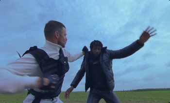 Movie still from “Dune & Crayon feat. Ichon - Pointless” (2020), directed by Alice Kong – Medium shot, Low angle