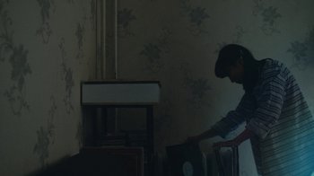 Movie still from “Depeche Mode (Trailer) - Spirits in the Forest” (2019), directed by Pasqual Gutierrez – Medium shot, High angle