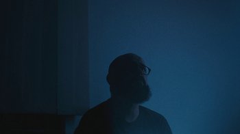 Movie still from “Depeche Mode (Trailer) - Spirits in the Forest” (2019), directed by Pasqual Gutierrez – Medium shot, Low angle