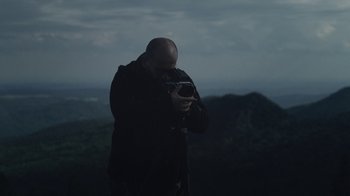 Movie still from “Depeche Mode (Trailer) - Spirits in the Forest” (2019), directed by Pasqual Gutierrez – Medium shot, Low angle