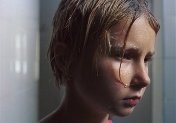 Movie still from “Låpsley - My Love Was Like The Rain” (2019), directed by Camille Summers-Valli – Extreme Close Up shot, Low angle