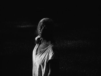 Movie still from “Alaskan Tapes - And, We Disappear” (2019), directed by Meredith Hama-Brown – Medium shot, Low angle