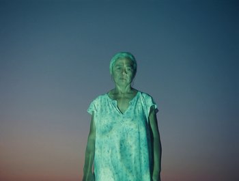 Movie still from “Alaskan Tapes - And, We Disappear” (2019), directed by Meredith Hama-Brown – Medium shot, Low angle