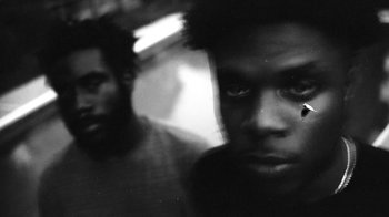 Movie still from “Jurdan Bryant - Words for Thomas” (2019), directed by Alonzo Hellerbach – Extreme Close Up shot, Low angle