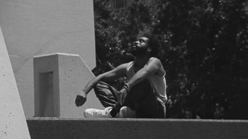 Movie still from “Jurdan Bryant - Words for Thomas” (2019), directed by Alonzo Hellerbach – Medium shot, Low angle