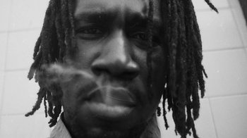 Movie still from “Jurdan Bryant - Words for Thomas” (2019), directed by Alonzo Hellerbach – Extreme Close Up shot, Low angle