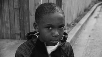 Movie still from “Jurdan Bryant - Words for Thomas” (2019), directed by Alonzo Hellerbach – Close Up shot, High angle