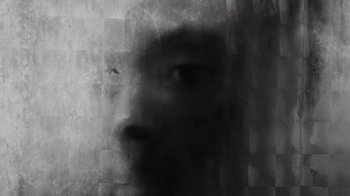 Movie still from “Jurdan Bryant - Words for Thomas” (2019), directed by Alonzo Hellerbach – Extreme Close Up shot, Overhead angle