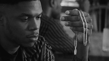 Movie still from “Jurdan Bryant - Words for Thomas” (2019), directed by Alonzo Hellerbach – Close Up shot, Over the shoulder angle