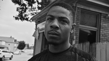 Movie still from “Jurdan Bryant - Words for Thomas” (2019), directed by Alonzo Hellerbach – Close Up shot, Low angle