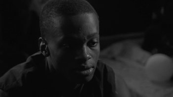 Movie still from “Jurdan Bryant - Words for Thomas” (2019), directed by Alonzo Hellerbach – Close Up shot, Low angle
