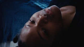 Movie still from “Jurdan Bryant - Words for Thomas” (2019), directed by Alonzo Hellerbach – Extreme Close Up shot, Low angle