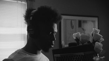 Movie still from “Jurdan Bryant - Words for Thomas” (2019), directed by Alonzo Hellerbach – Close Up shot, Low angle